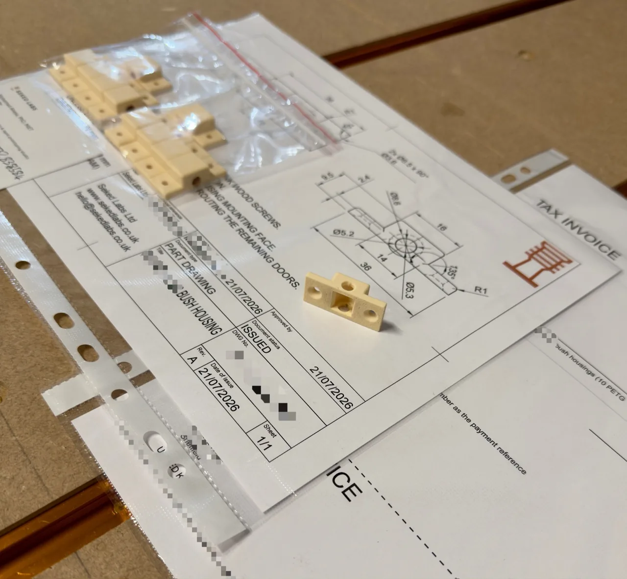 Custom FDM 3D printed bushing housing on its engineering drawing at Seked Labs in Sheffield